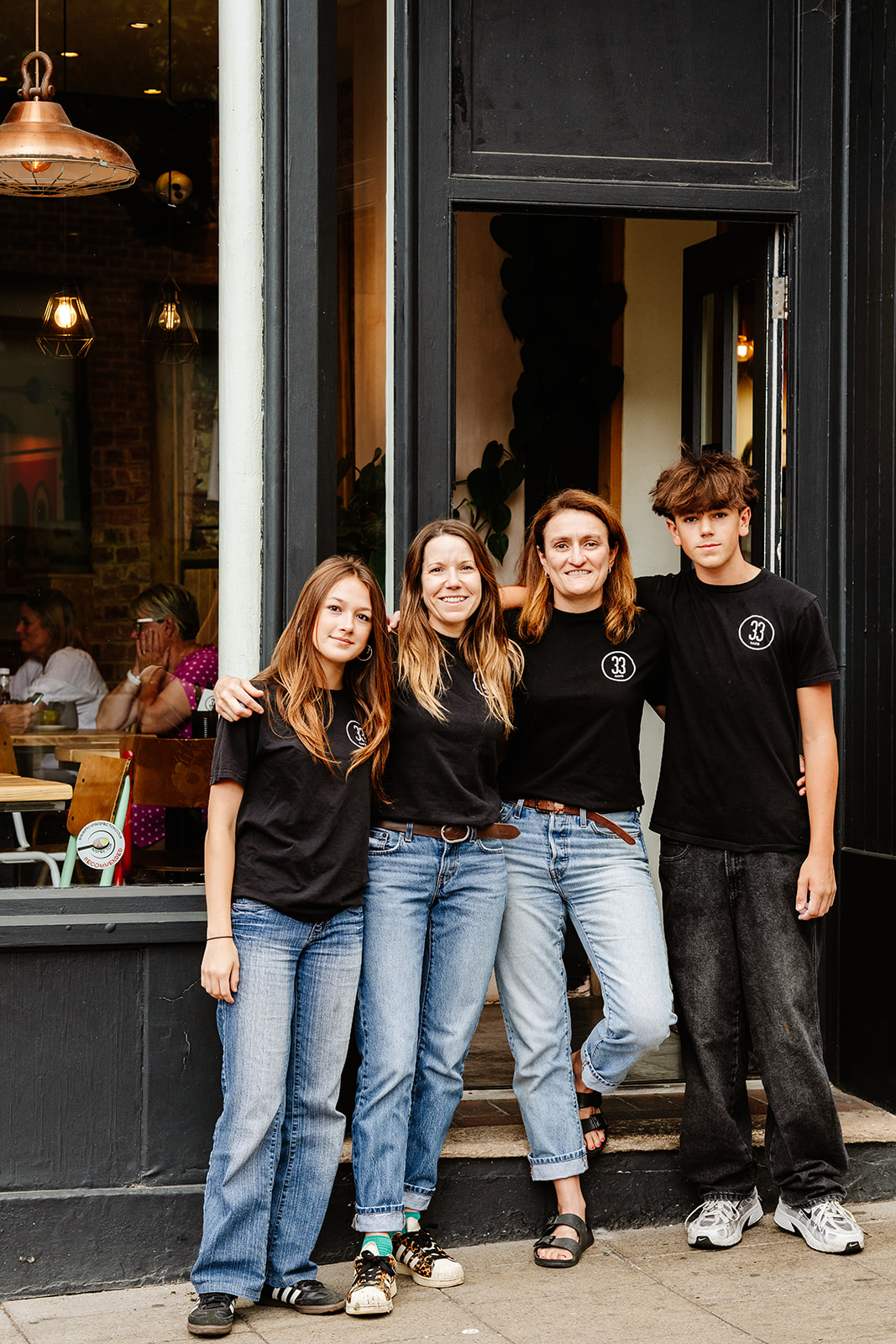 Nichola, Madelie and family outside No33, 33 Exchange Street, Norwich